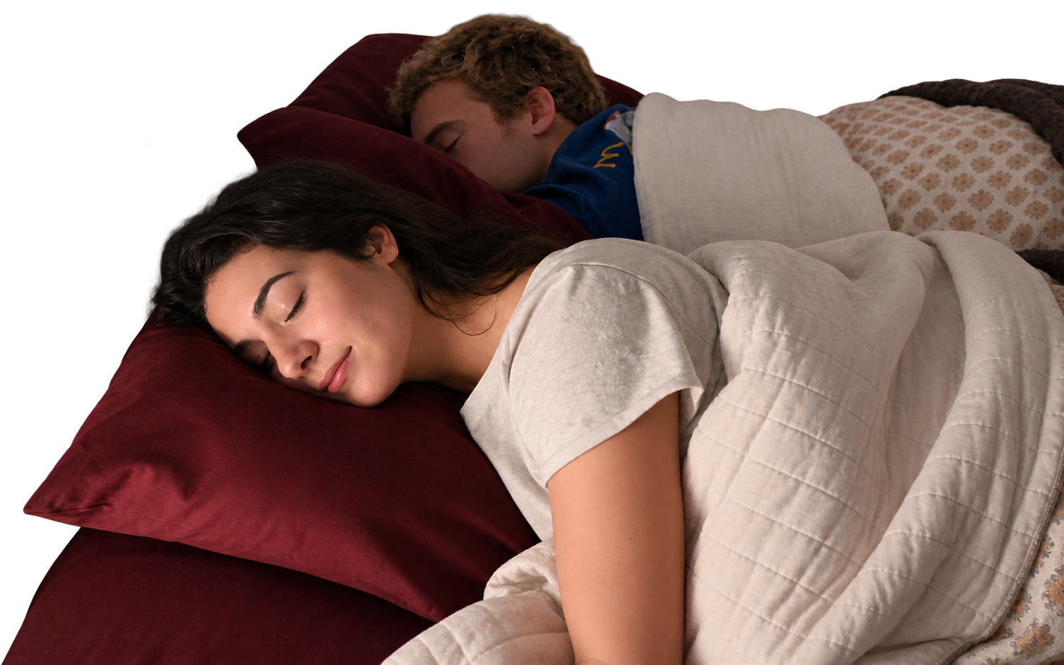 Two people asleep on separate pillows. A Lullabar slides under the near pillow, and the sound spreads through that pillow and stops at its edge, well short of the sleeper on the next pillow.